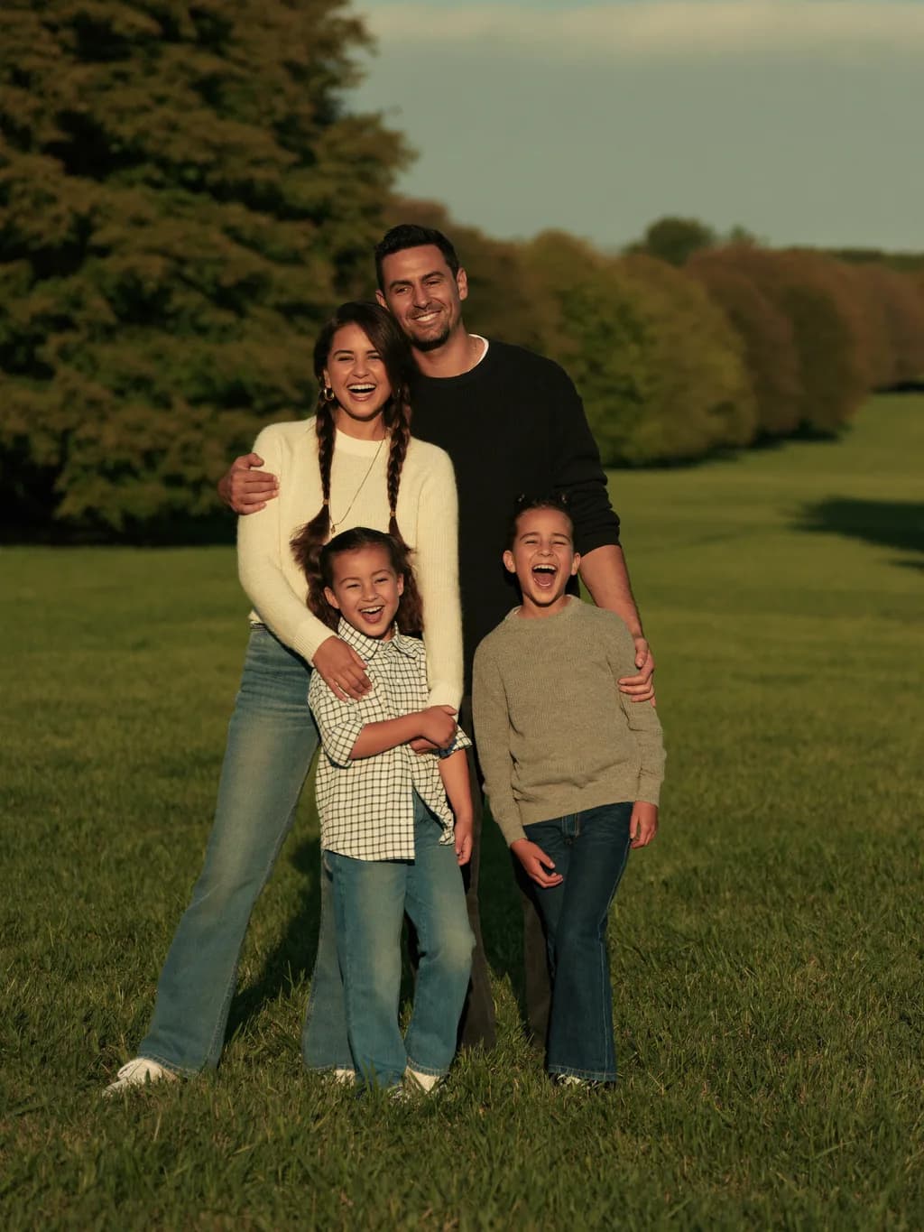 A portrait of a family gathered close